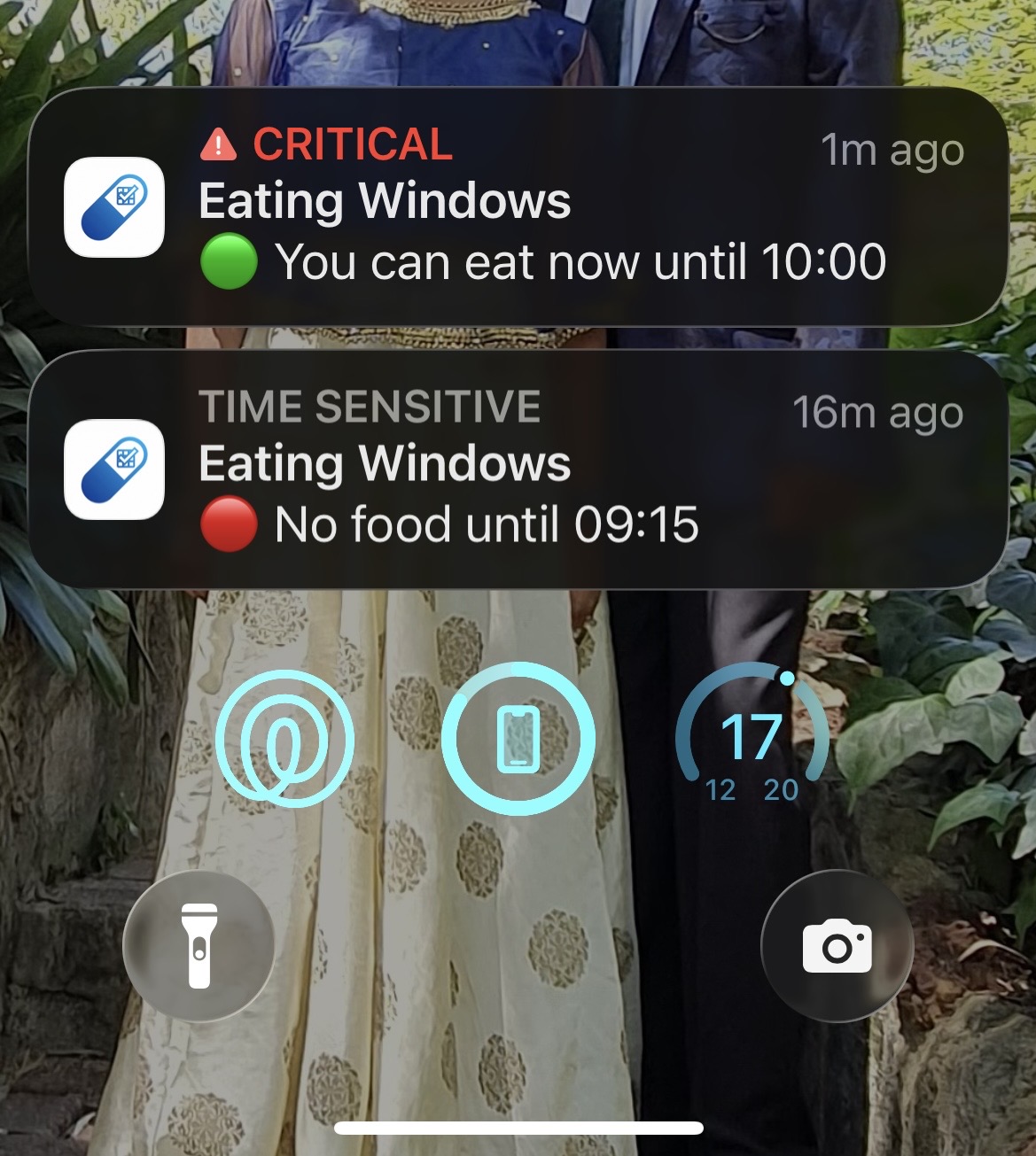 A phone lock screen showing MediRemind Eating Windows notifications for an active eating window and a later period